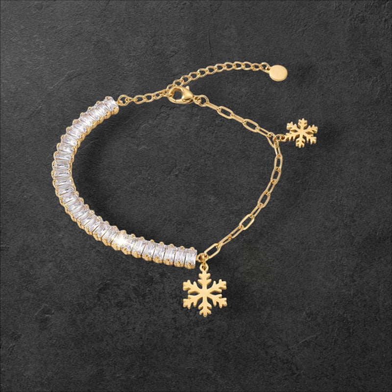 An elegant gold bracelet made of rust-resistant stainless steel, combining the sparkle of shiny zircon stones and delicate snowflake pendants, with an adjustable clasp to fit you. - Image 4